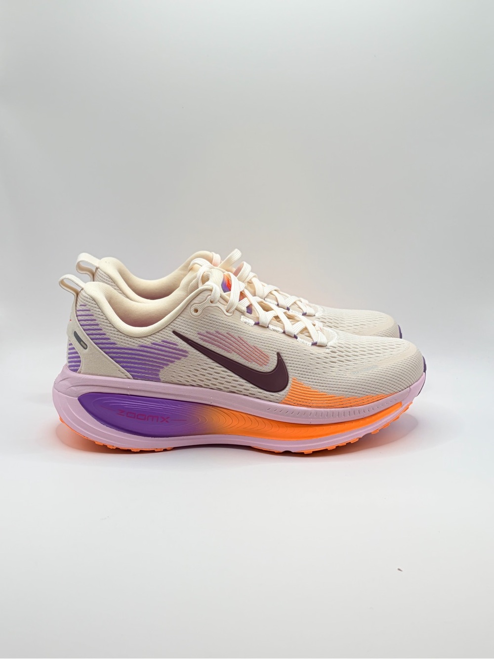 Nike Cream Running Shoes with Purple & Orange Accents